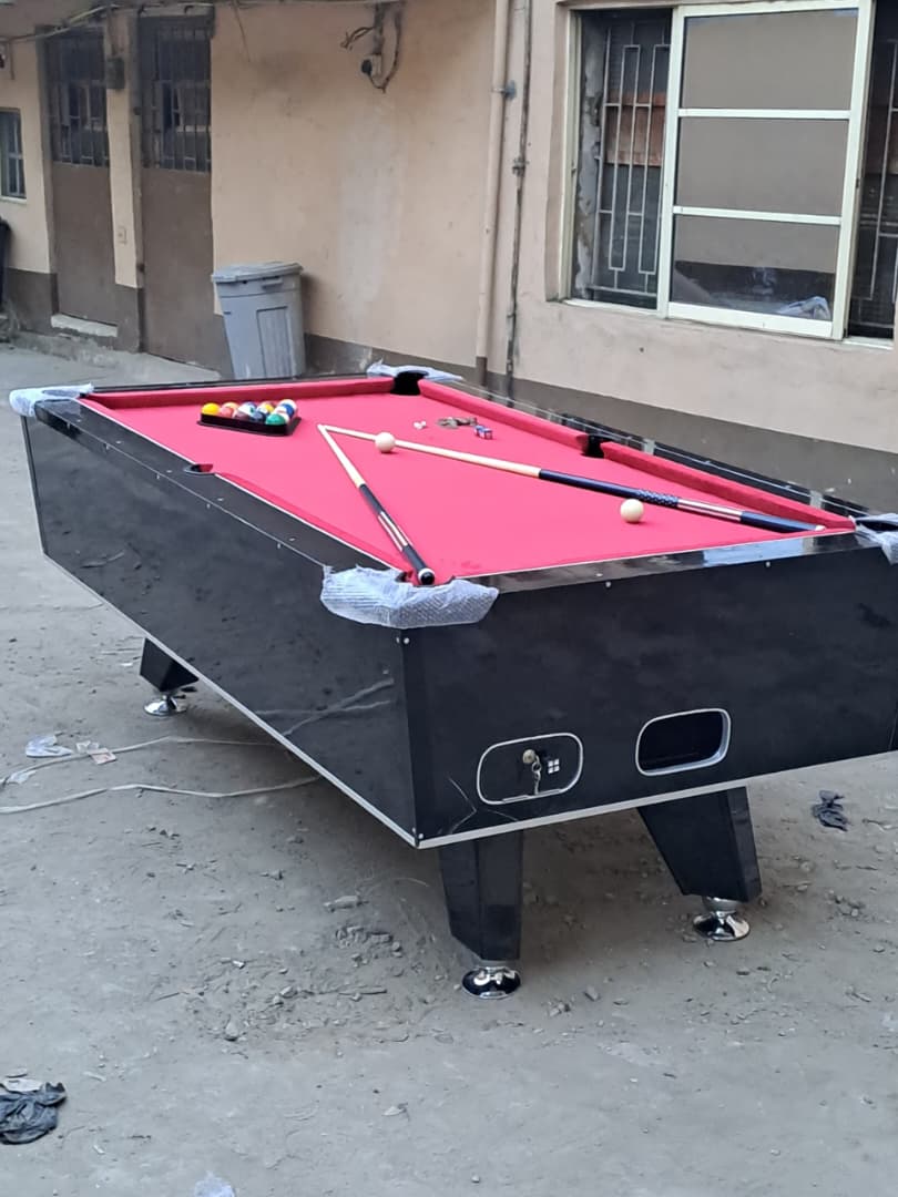Coin snooker board with red cloth